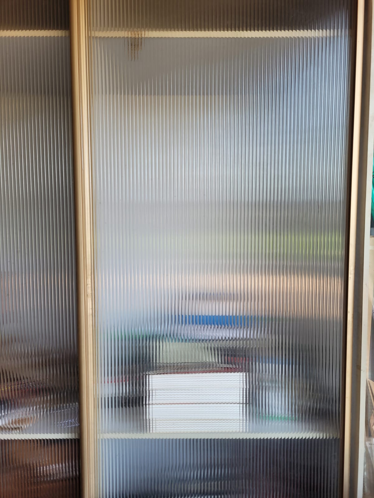 Clear fluted panel — Fine vertical fluting shown at display-panel scale.