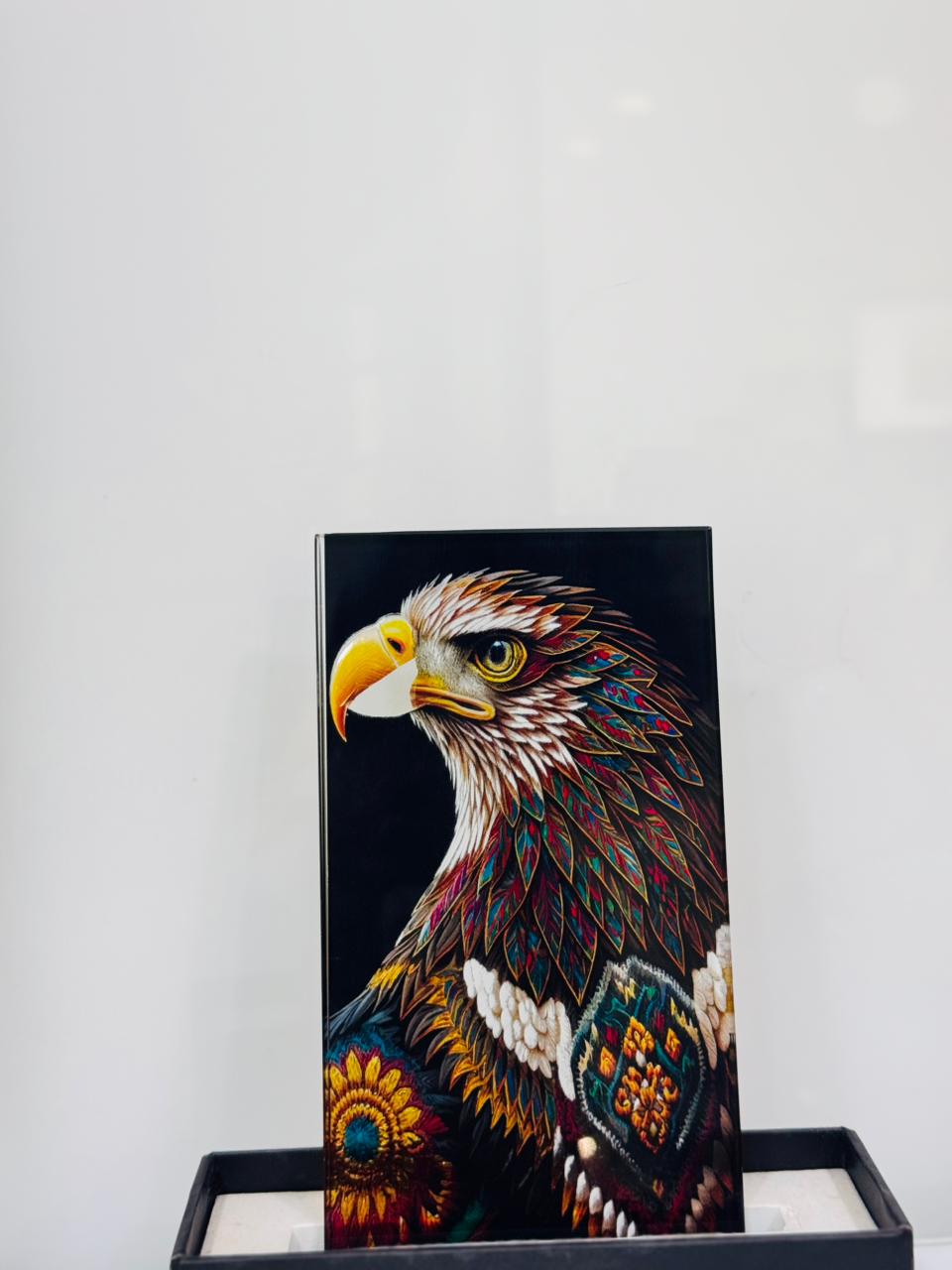 Eagle art glass — A richly coloured eagle illustration on a dark ground.