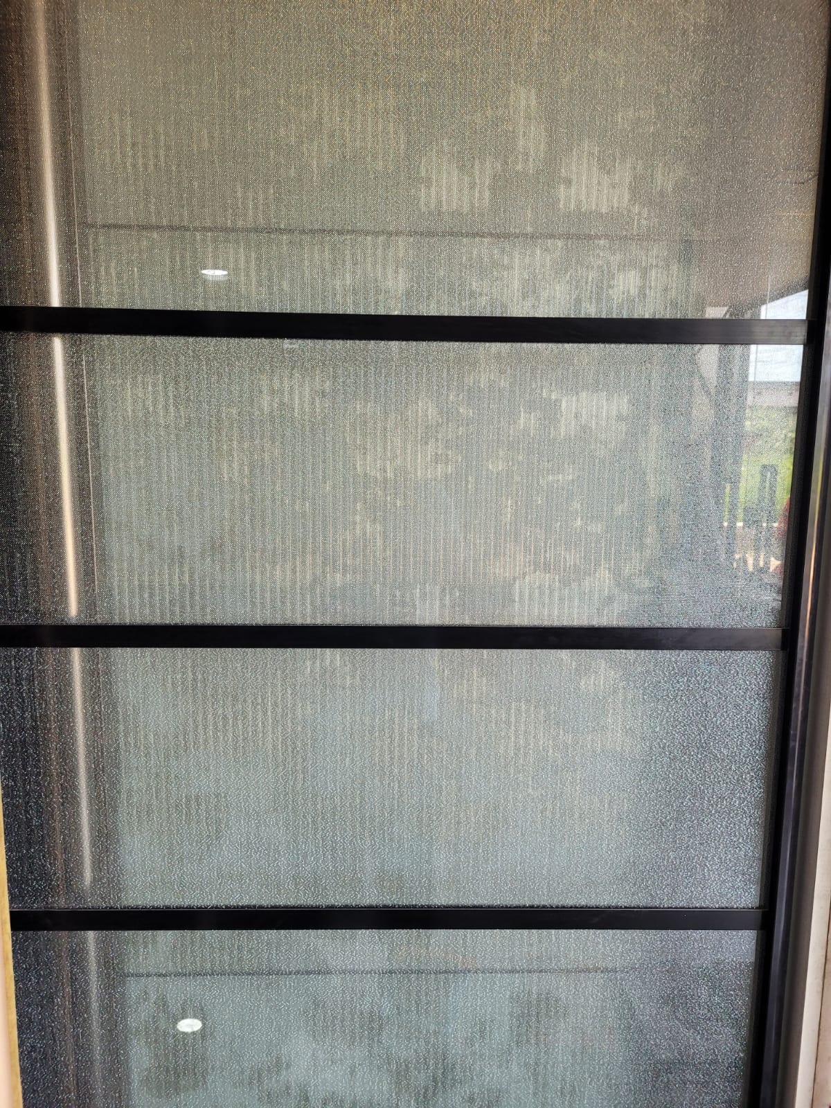 Fine-texture panel — A fine textured surface in a framed showroom panel.