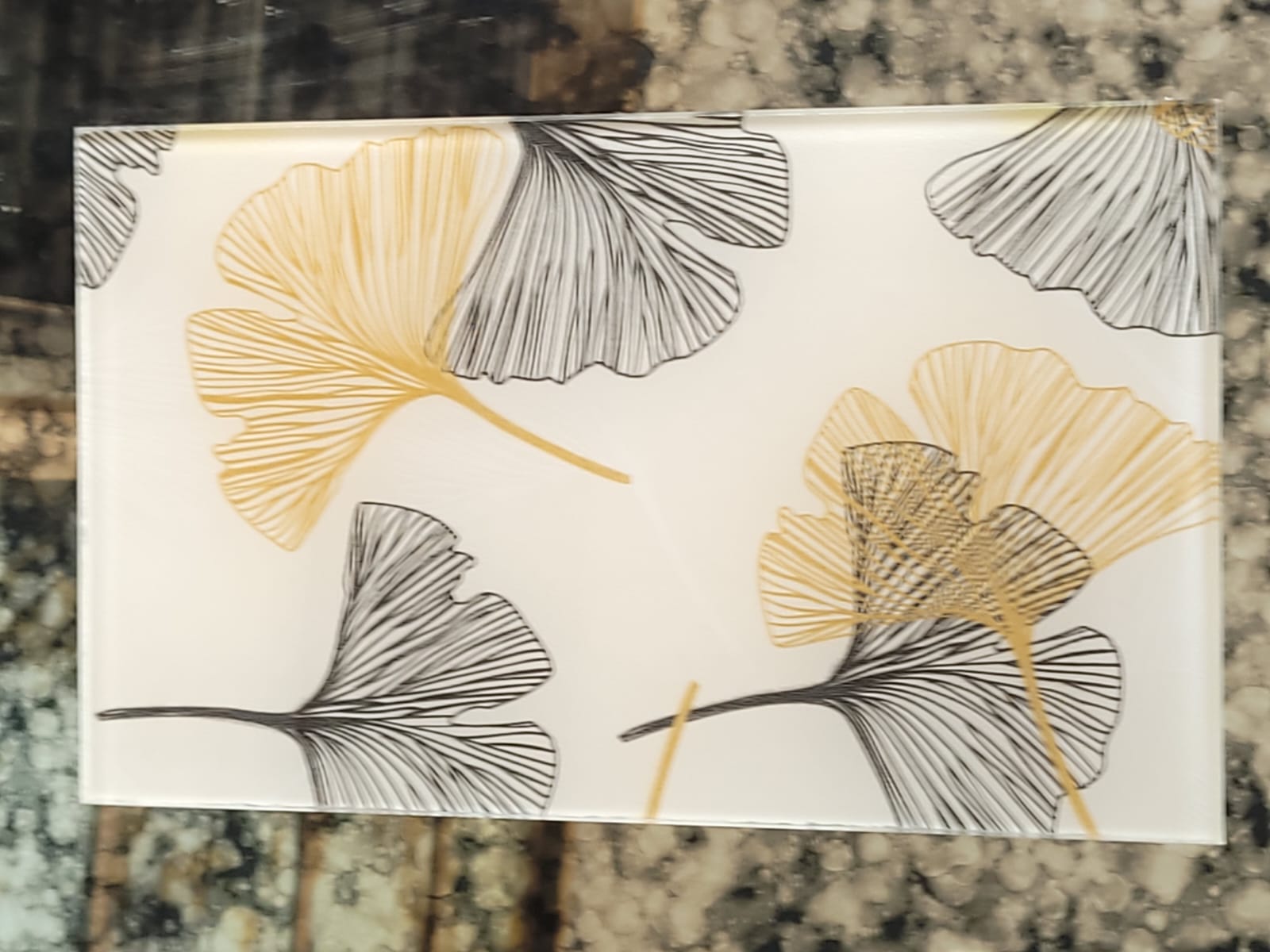 Ginkgo-leaf glass — Fine-lined ginkgo leaves in gold and black.