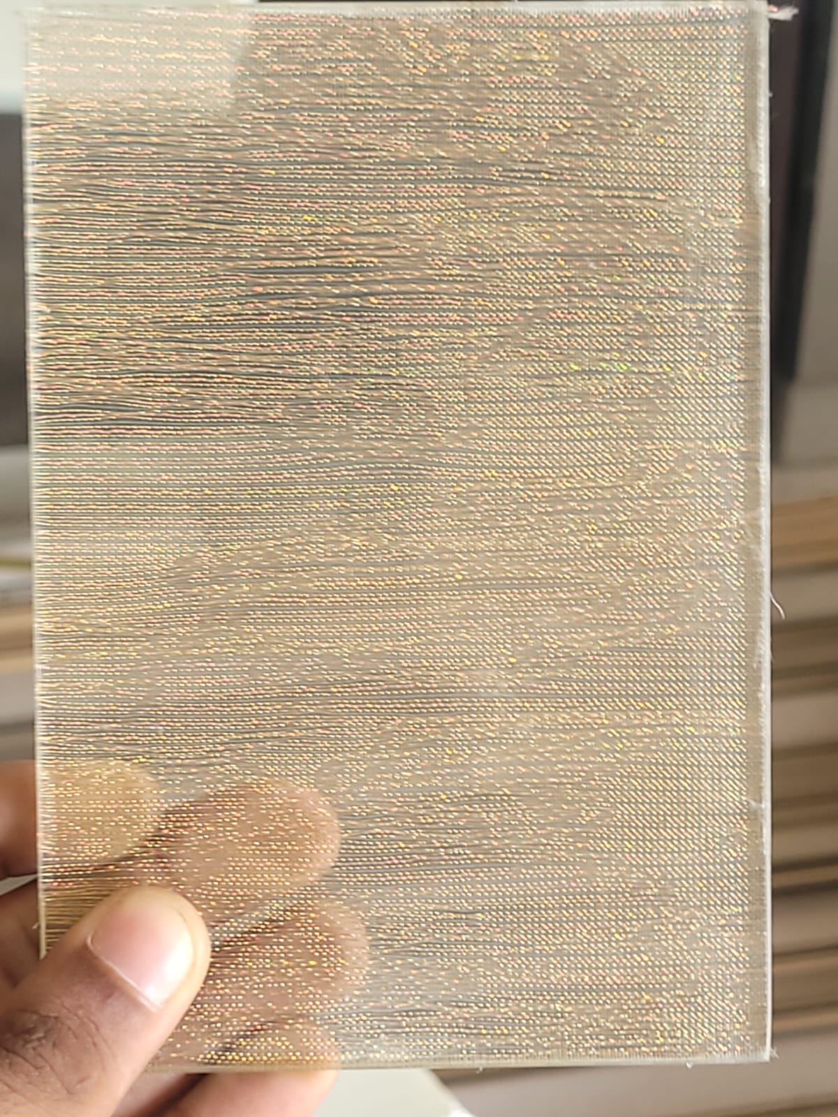 Gold woven texture — A shimmering gold-toned woven finish.