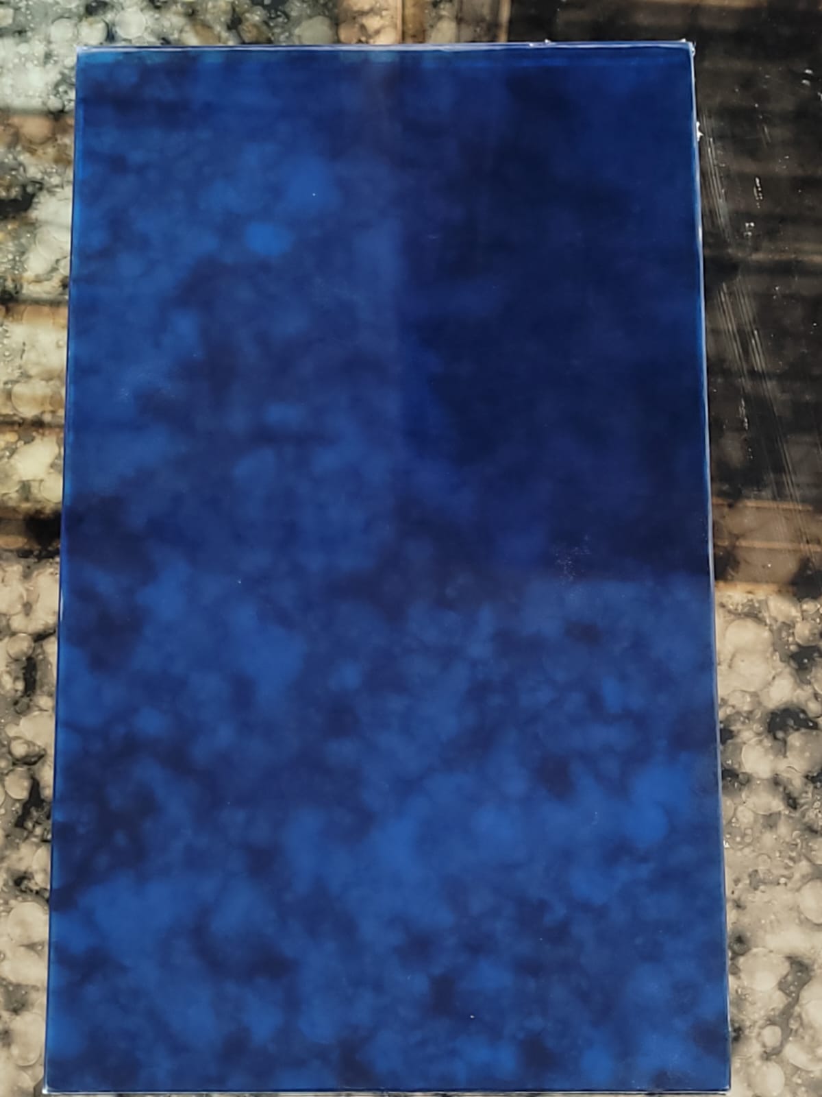Mottled blue glass — Deep blue with a softly mottled surface appearance.