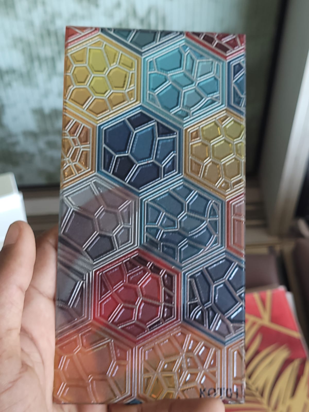 Multicolour hexagon glass — Layered hexagons in blue, gold and warm accent colours.
