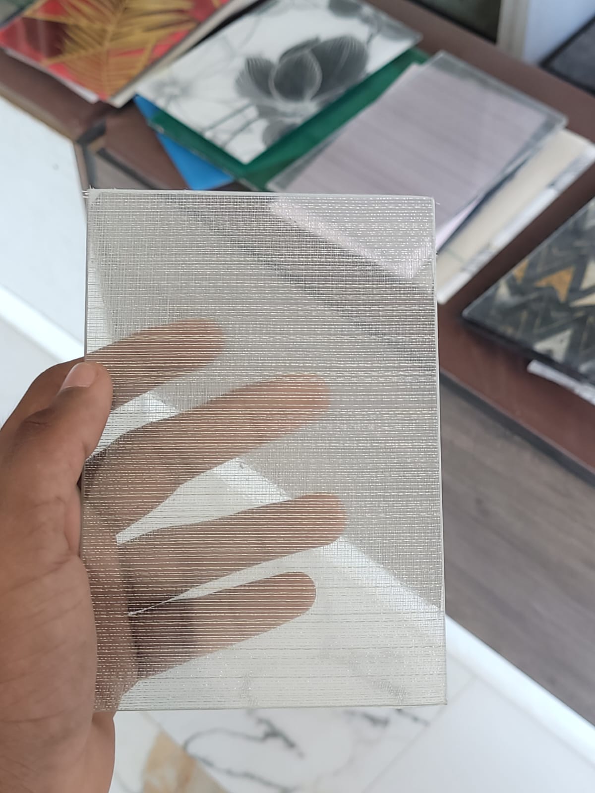 Silver woven texture — Fine silver-toned lines with a fabric-like appearance.