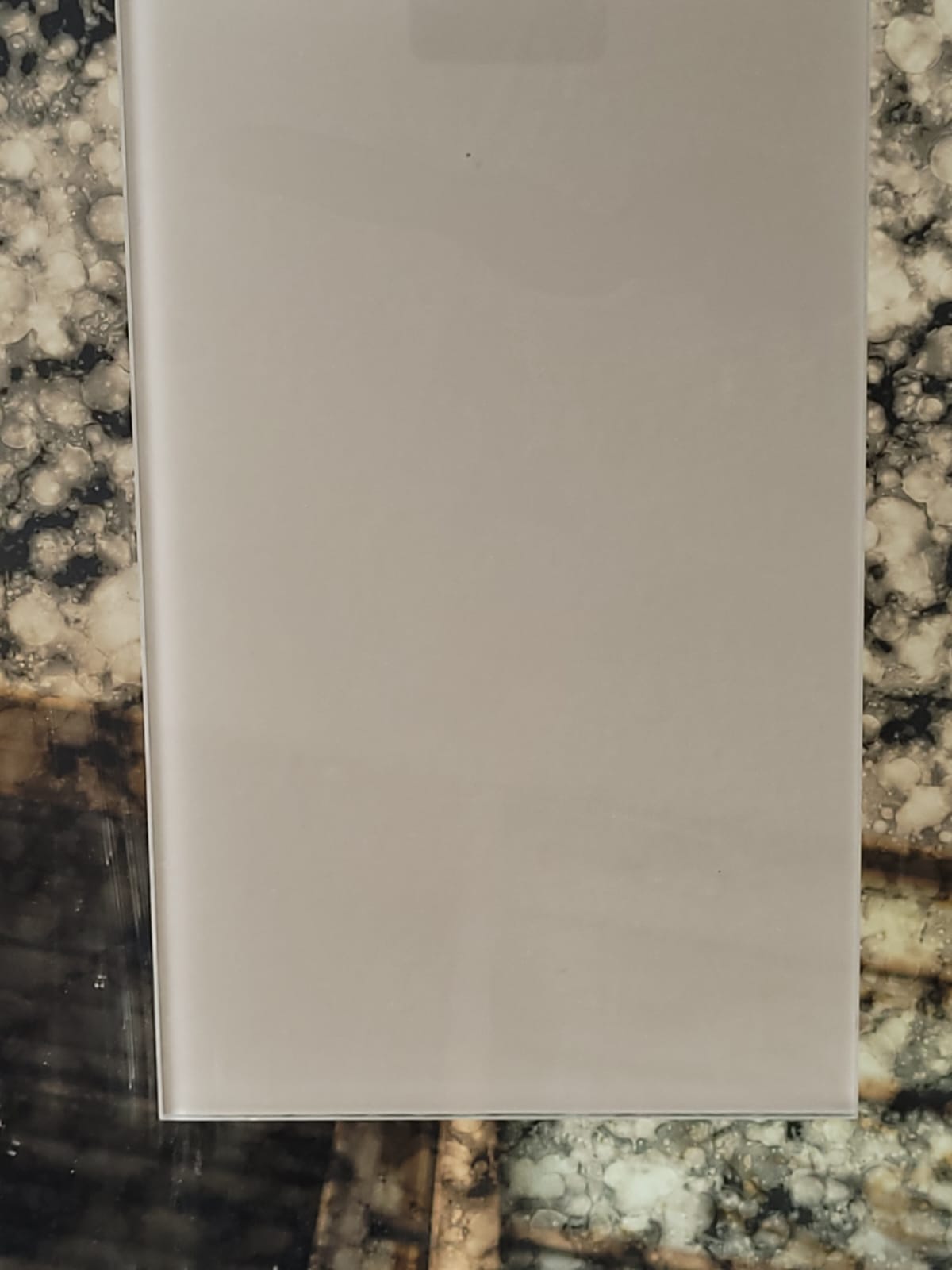 Warm grey glass — A smooth neutral finish in warm grey.